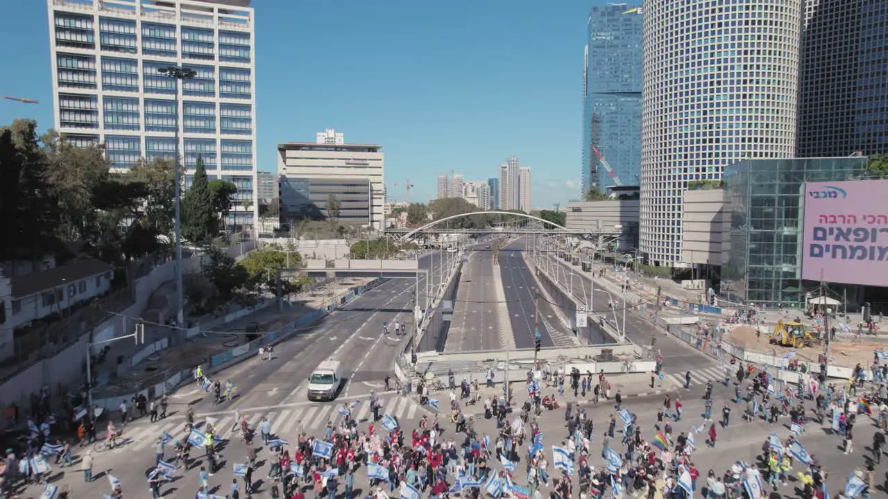 drone fly over crowds of Israelis with flags at the protest intersection against Supreme court trample