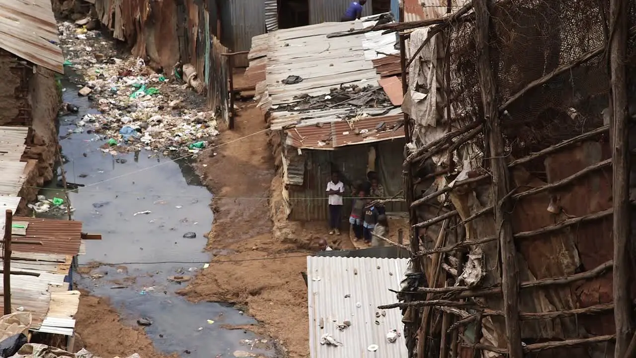 Children playing near open air sewage in Kibera Nairobi