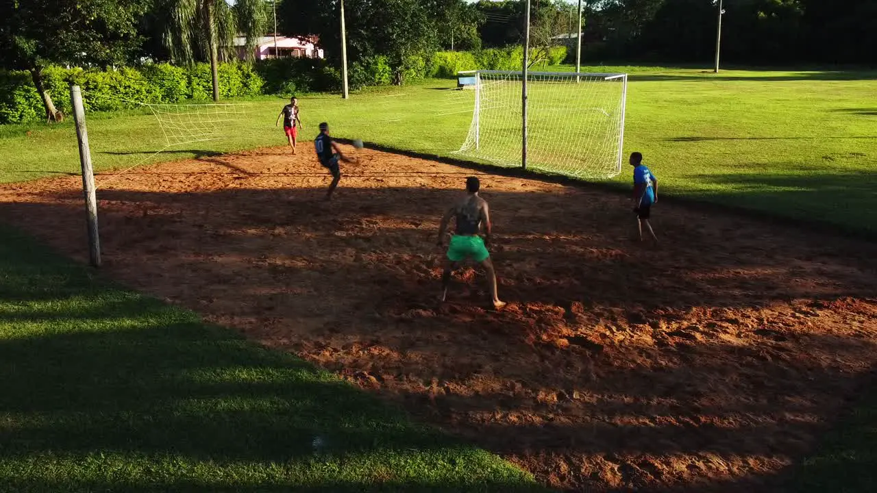 Young People Playing Foot Volleyball A Traditional Sport In Paraguay