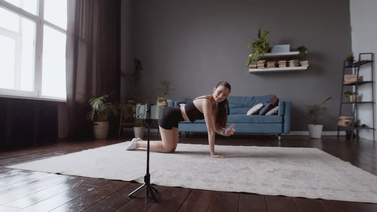 Wide Shot Of An Exultant Athletic Young Woman Giving An Online Fitness Lesson