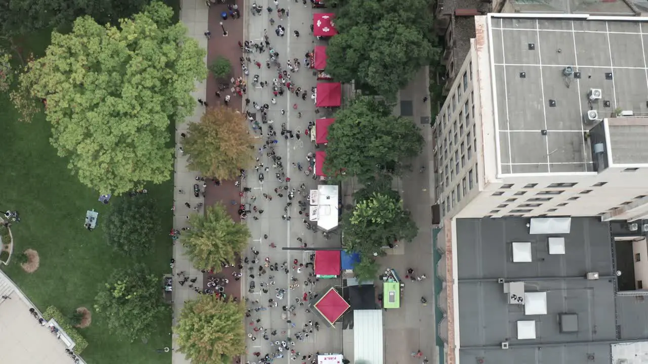 People attending Taste of Madison food festival in Madison Wisconsin with drone overhead view