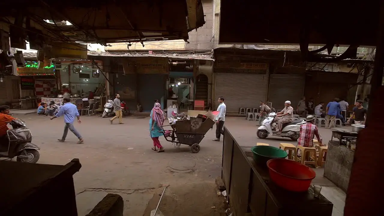 Indian Woman Parks a Cart in a Delhi Street