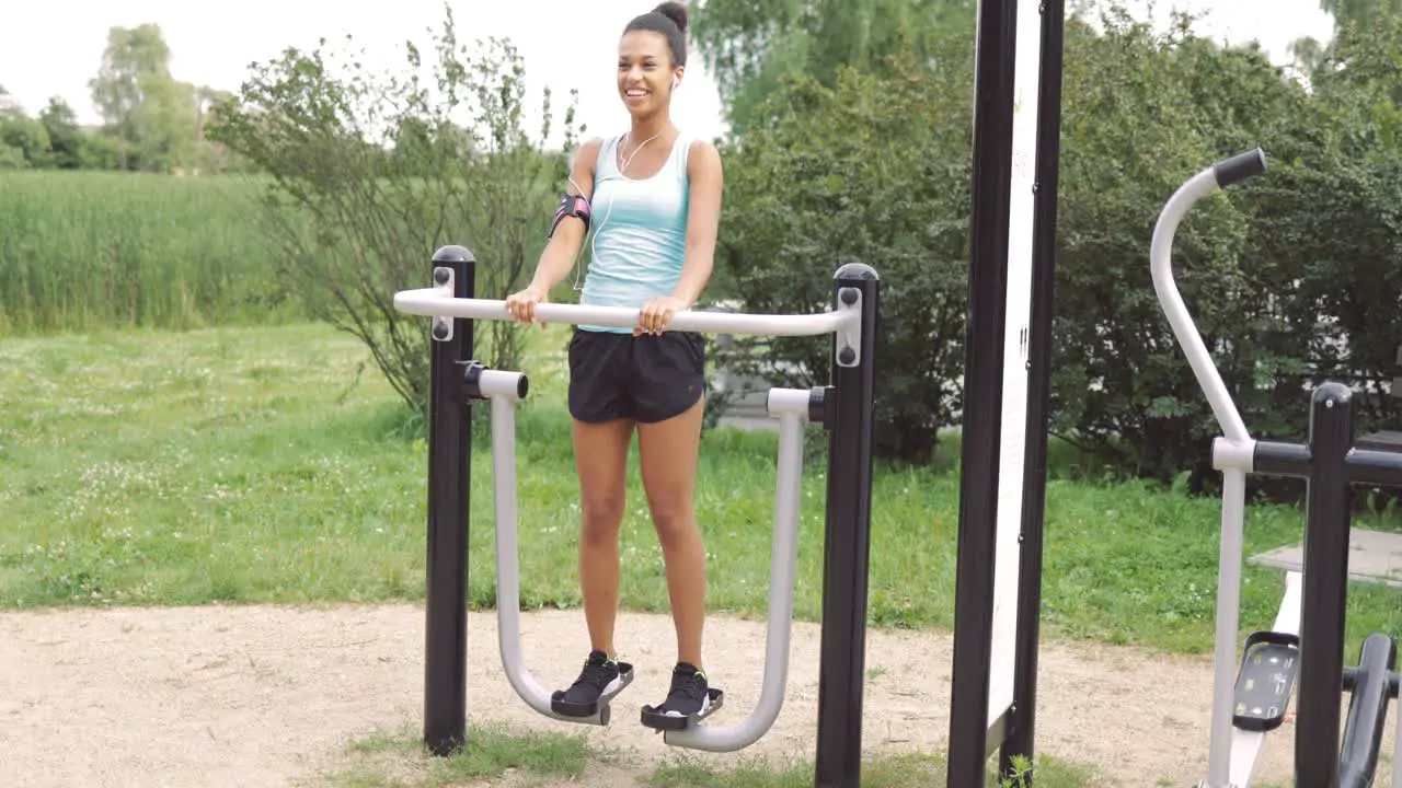 Cheerful girl training at street