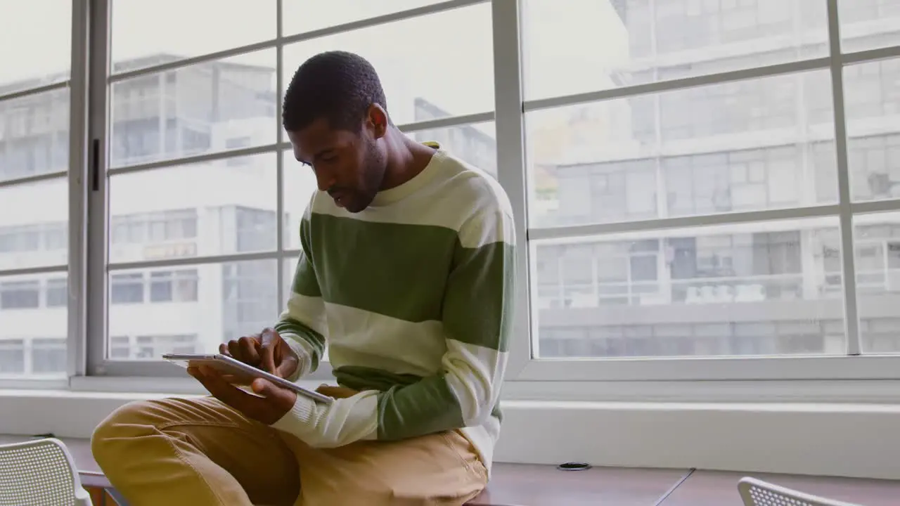 Businessman using digital tablet in a modern office 4k