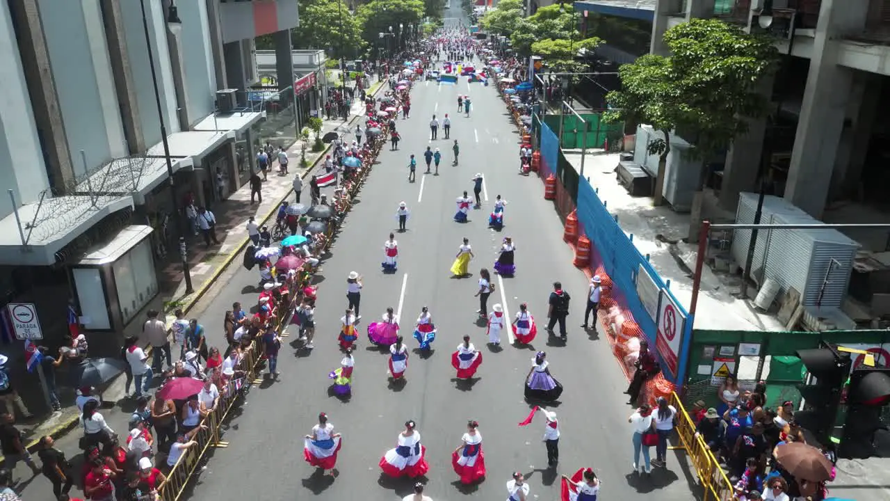 Drone Flying Over School Children in Traditional Dresses During Costa Rica Independence Day Parade