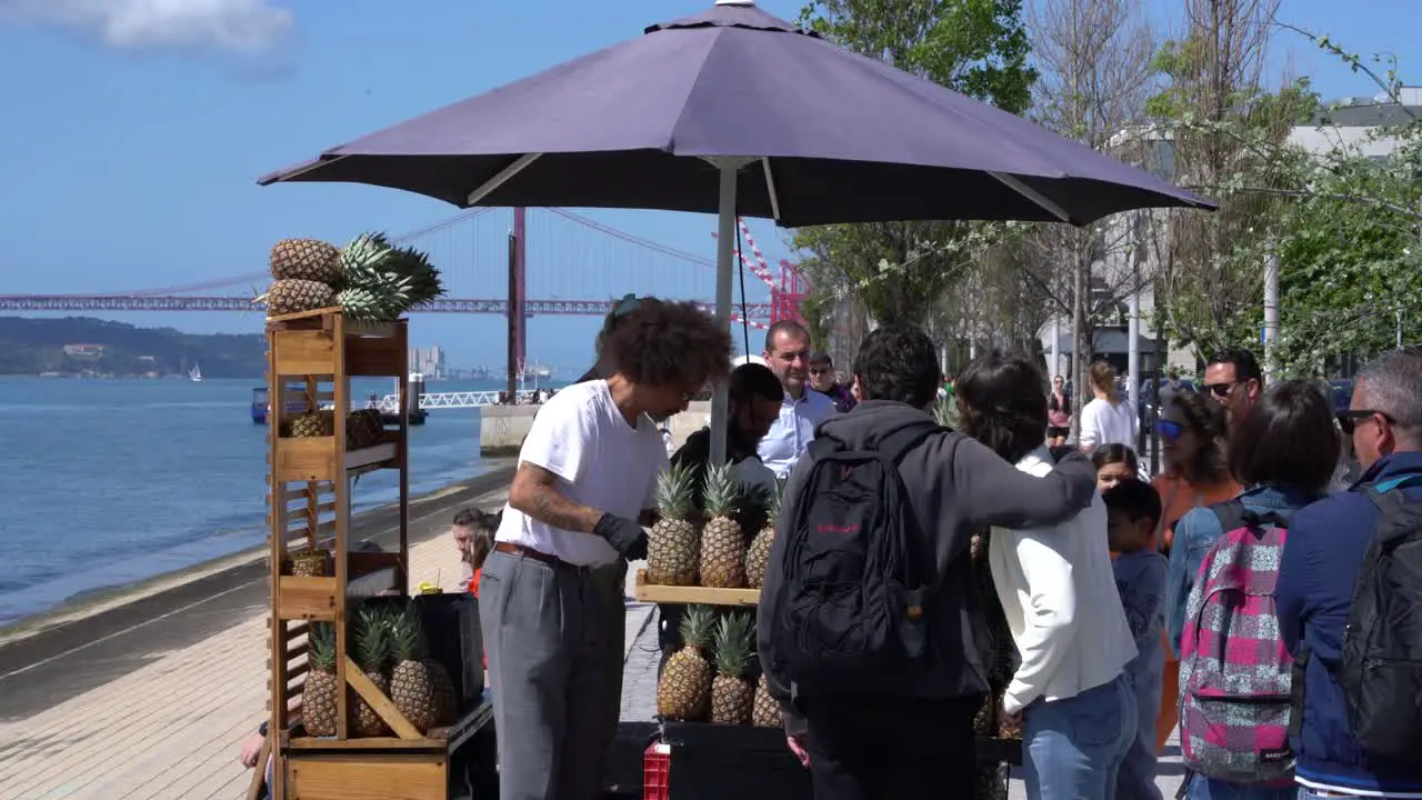 Street stall selling pineapples Avenida Ribeira was Naus Lisboa