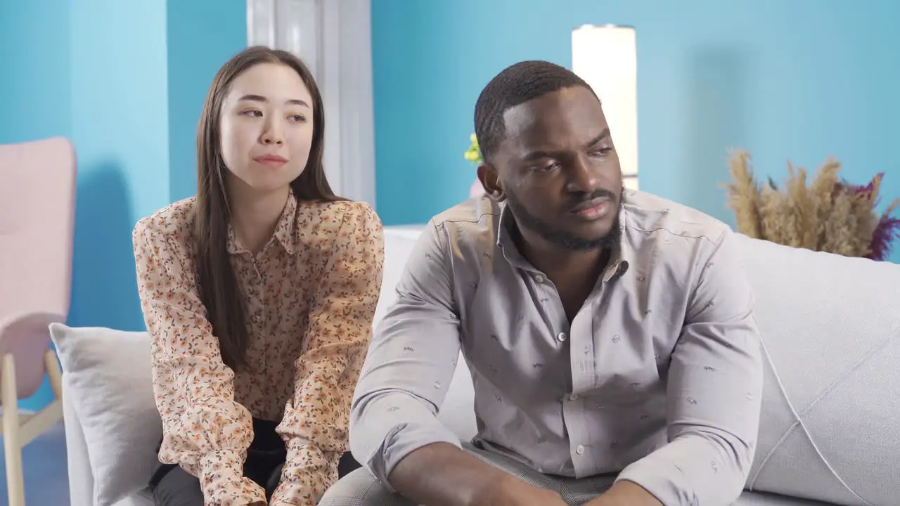 African young man offended at his Asian girlfriend