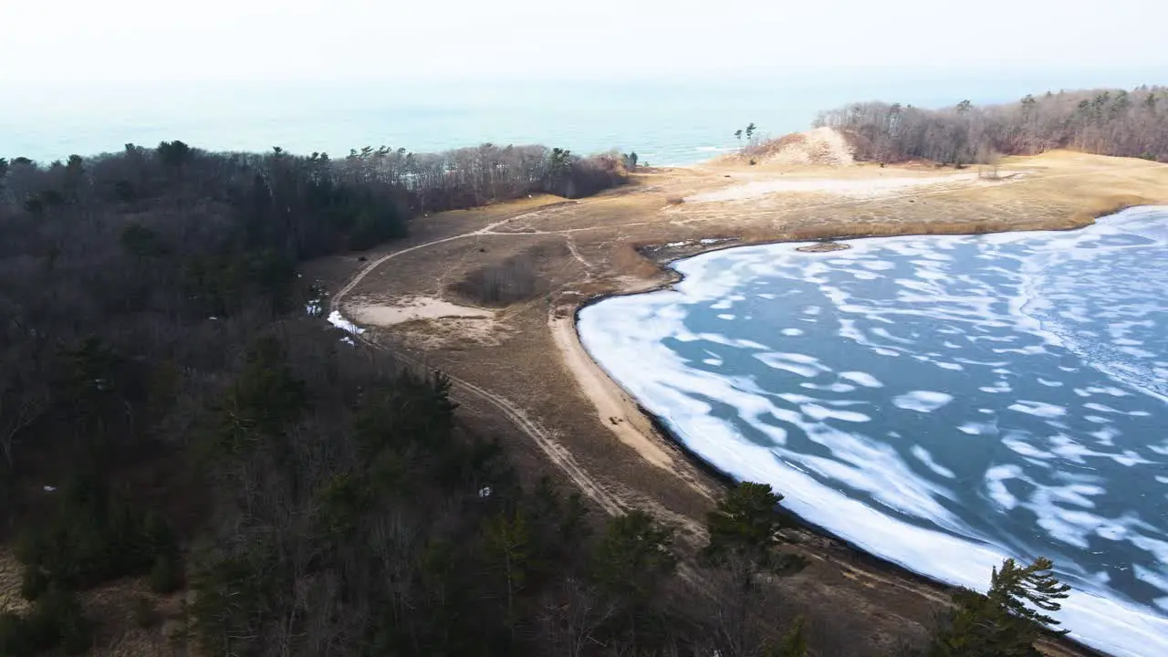 Ice cover over the deep waters of Dune Harbor Lake