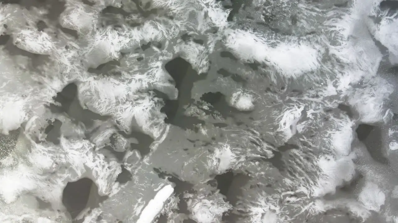 Vertical facing spin over intricate patterns in lake ice