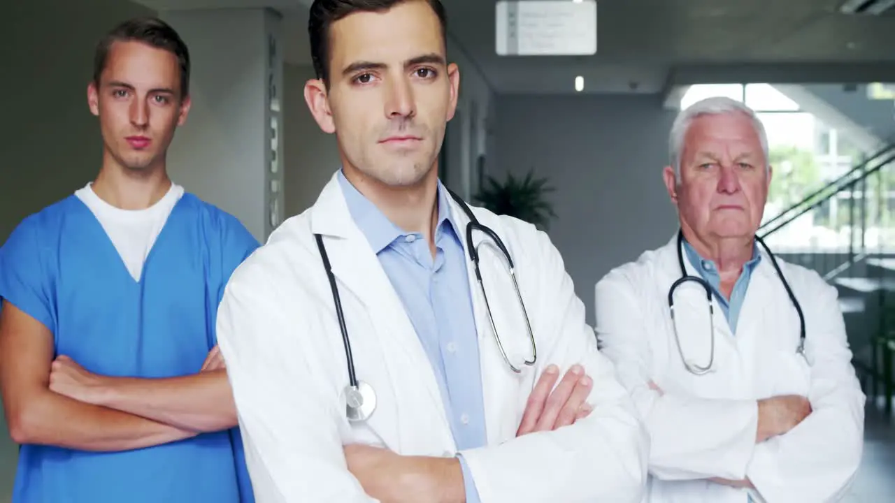 Portrait of doctor and nurse standing with arms crossed