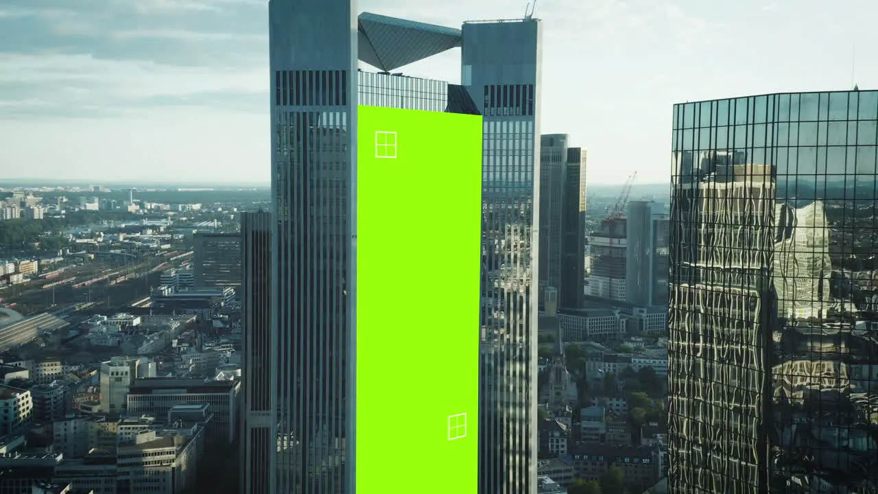 Fly around modern downtown skyscrapers with glossy grass facades Chroma key area for adding your content Frankfurt am Main Germany