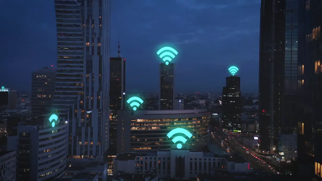 Evening aerial footage of modern city borough with high rise buildings Computer added Wifi symbols glowing above buildings Warsaw Poland