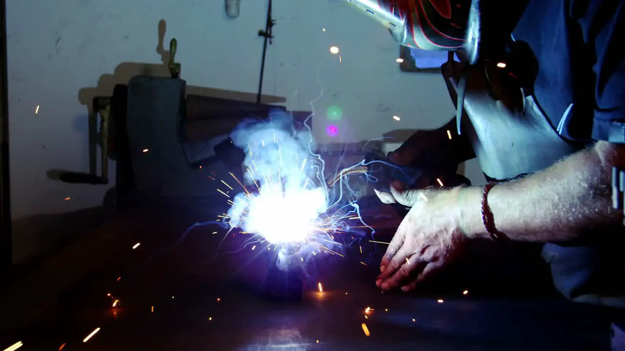 Welder working on a piece of metal