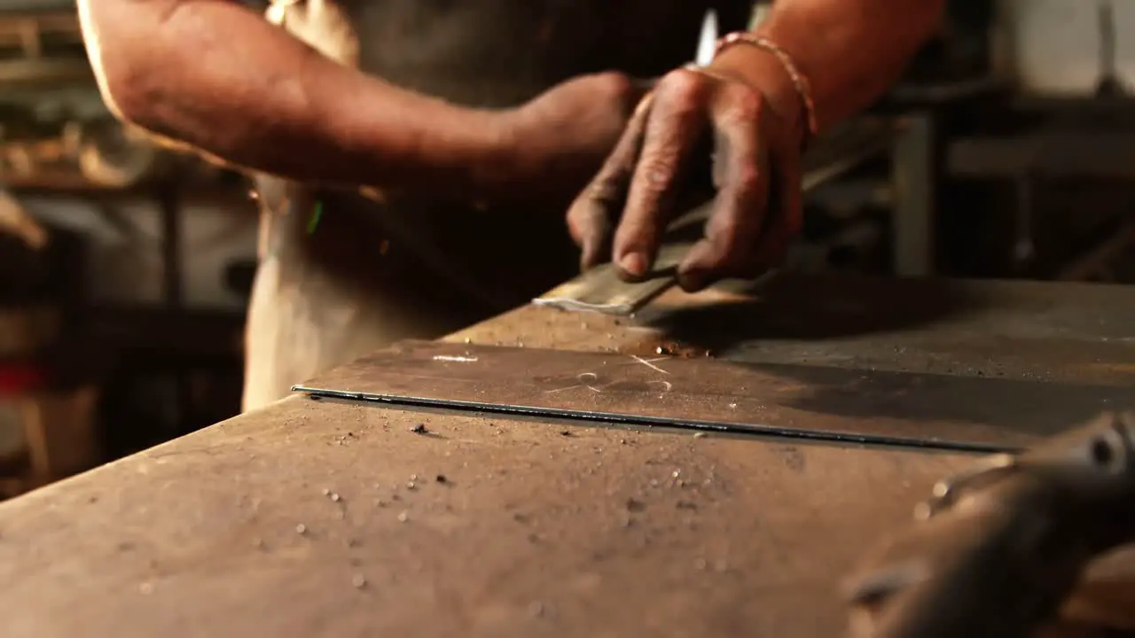 Mid section of welder working