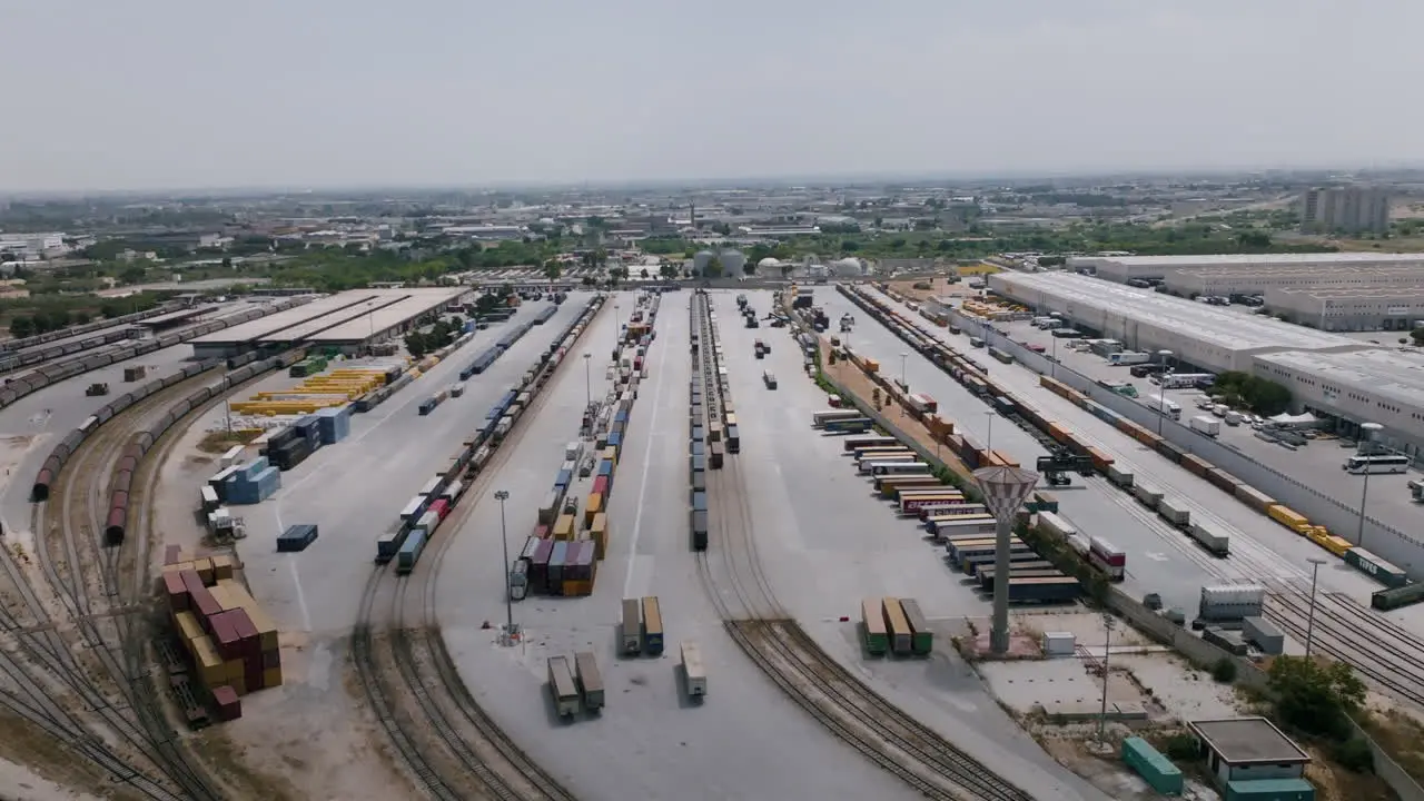 Slow aerial footage moving in on an industrial logistics shipping center in Bari Italy