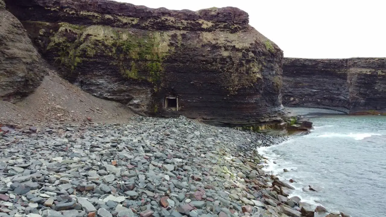 Approaching an abandonned mine on the coast with a hidden beach in the background