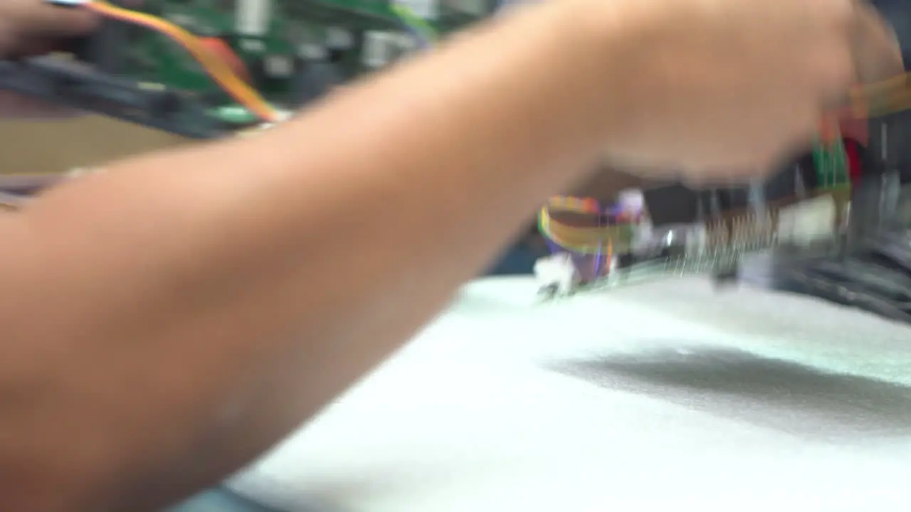 Woman assembling a control board