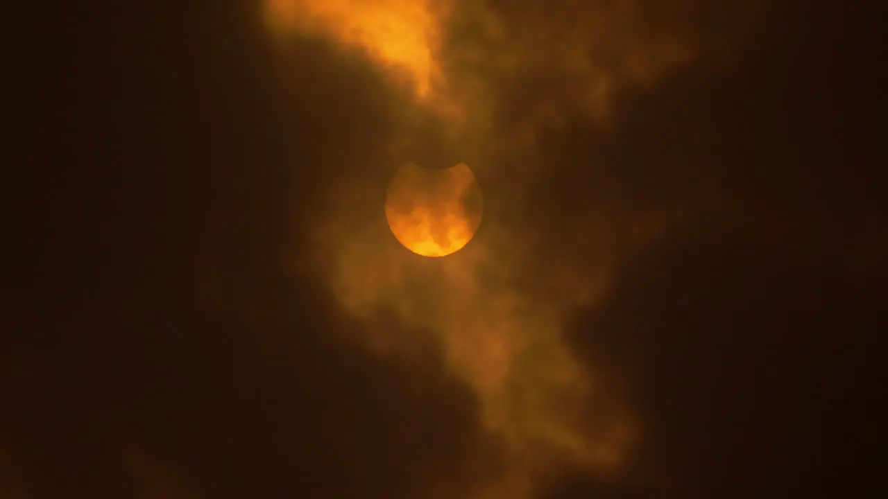 Beginning penumbra of an annular solar eclipse behind clouds October 14th 2023