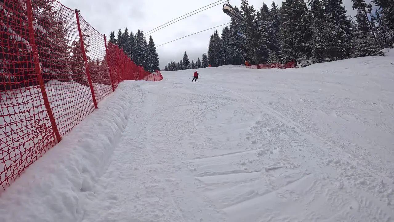 Skier Skiing Down Mountain And Covering Camera With Snow 1