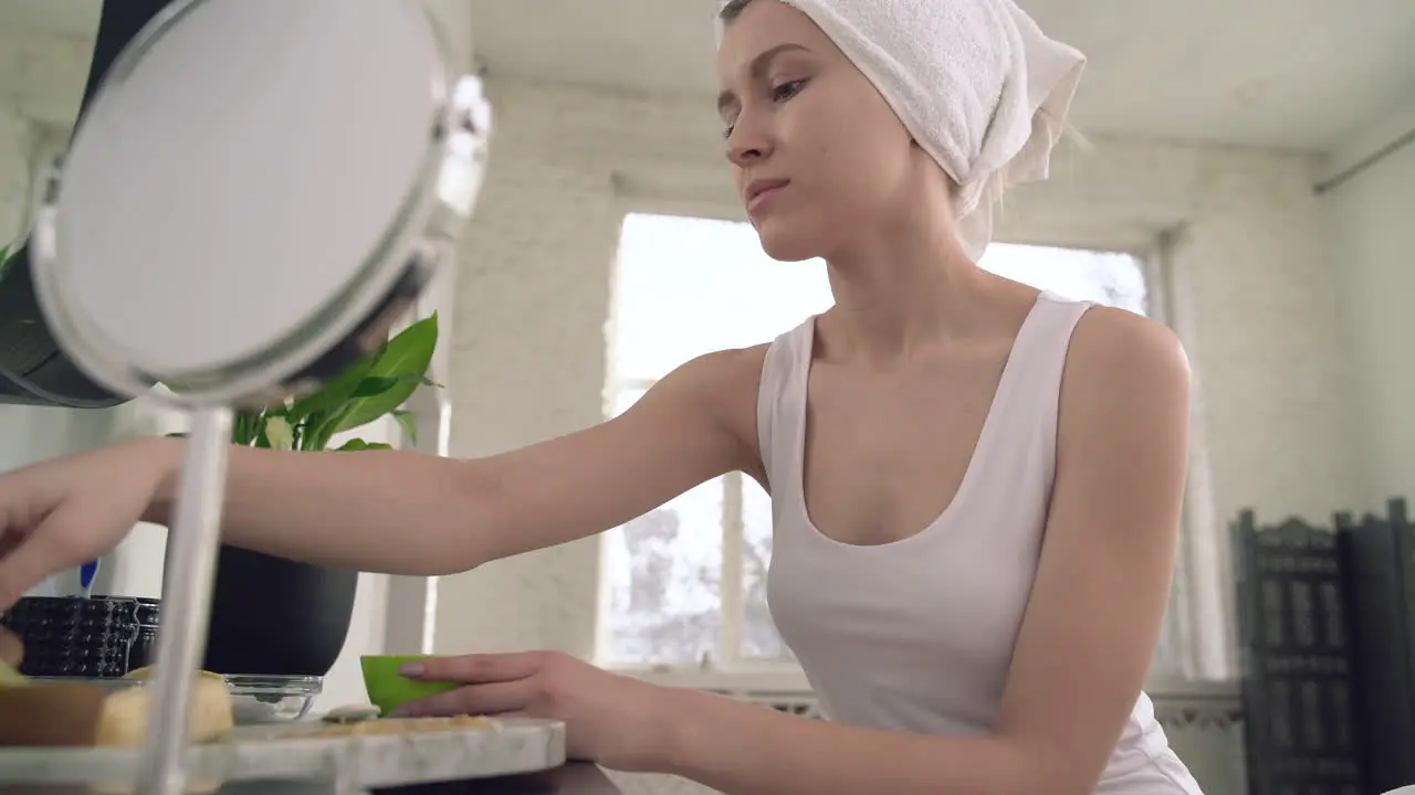 Female Preparing Facial Mask