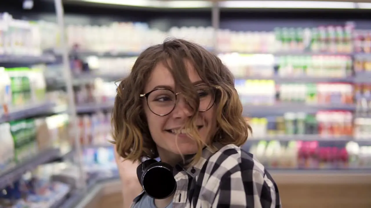 Happy Young Girl Funny Dancing Between Shelves In Supermarket 1