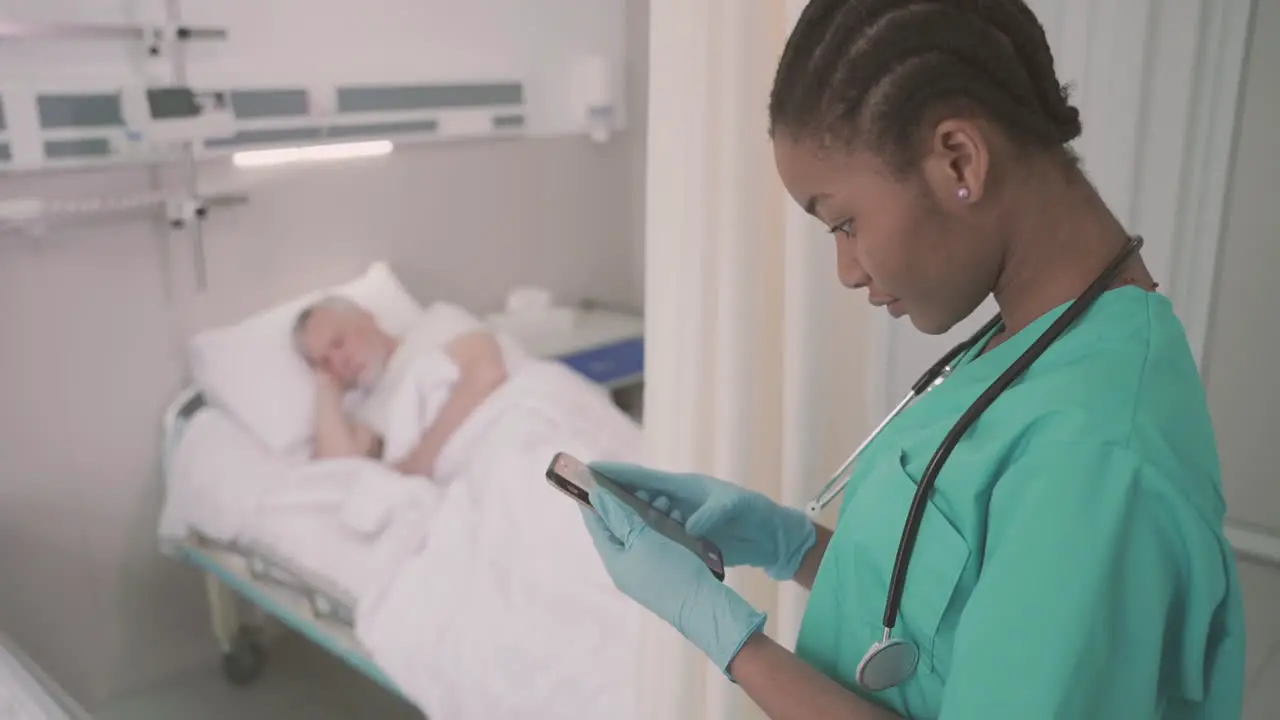 A Beautiful Young American Nurse Texting On Her Phone