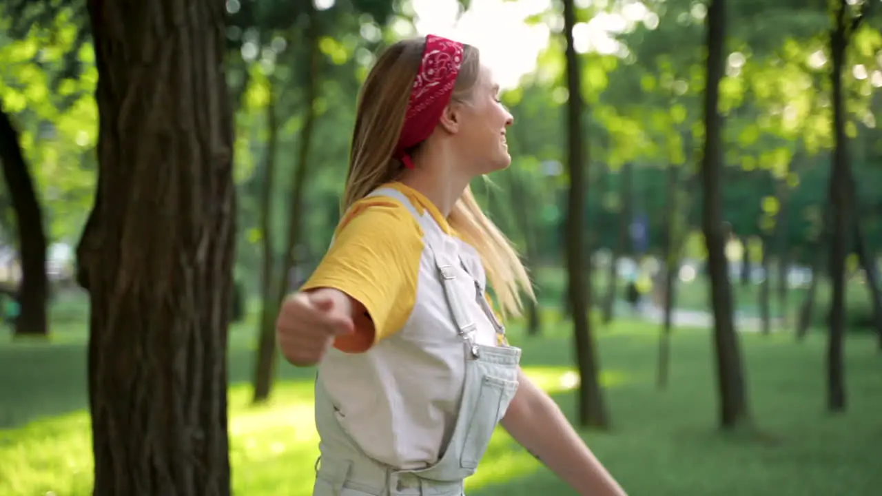 Happy Young Woman Enjoying Freedom In A Green Park