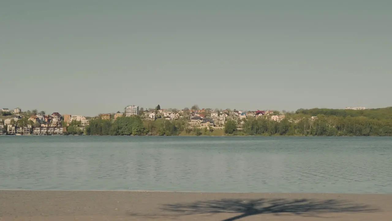 Young Skater Girl Crosses Skating The Screen Passing In Front Of A Beautiful View Of The River 1