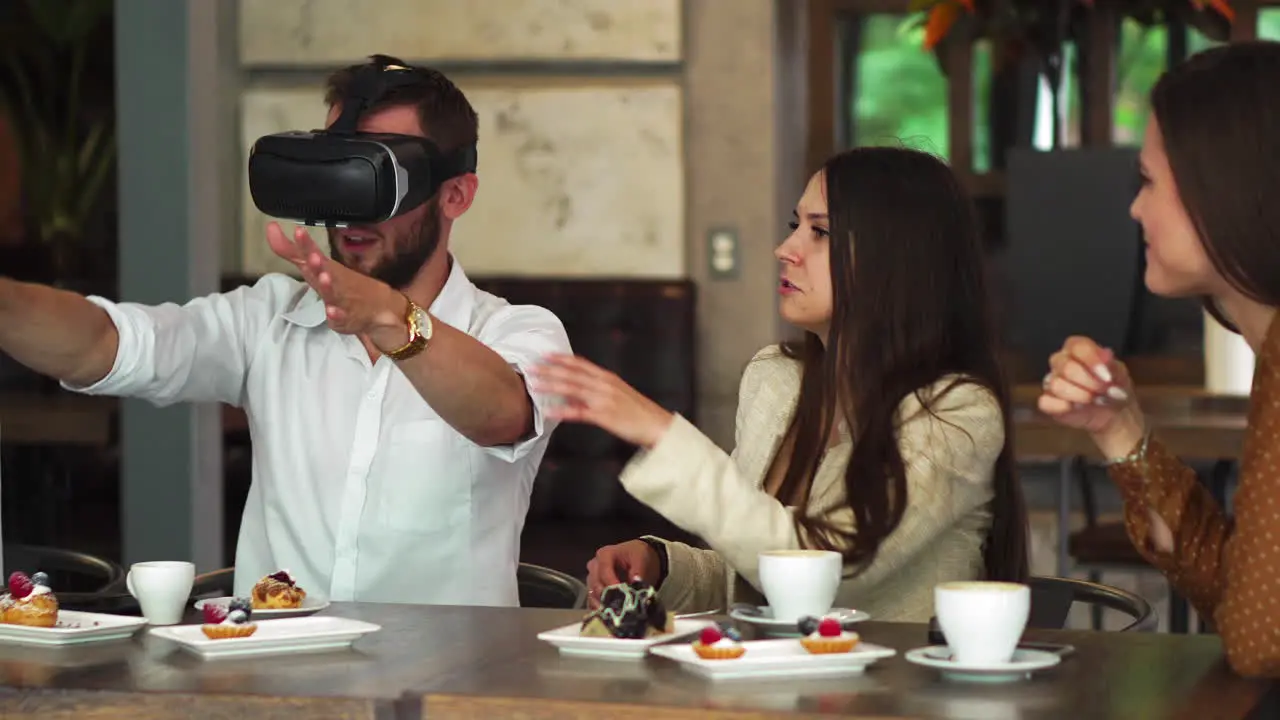 Group of young entrepreneurs in a meeting with VR headset