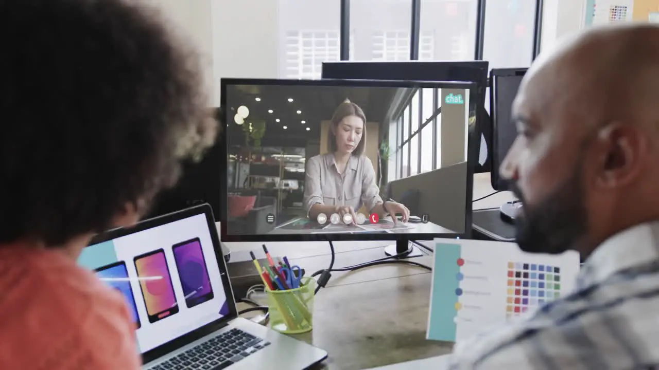 African american business people on video call with caucasian female colleague on screen