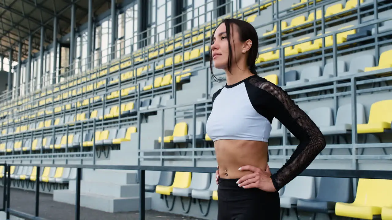 Beautiful Sportive Woman Concentrating Before Outdoor Exercise In The Stadium 1