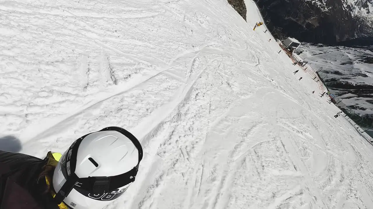 Action Shot Of Skier Skiing Down Snow Covered Mountain Slope Solden Austria