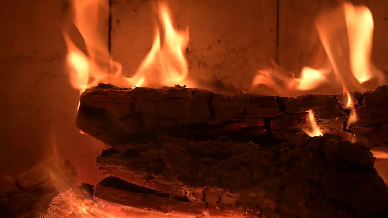 romantic fireplace during xmas Christmas winter holiday extreme close up of burning flame