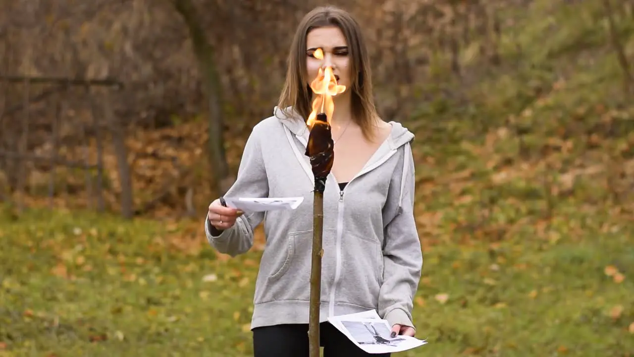 Sad Vocalist Girl Singing And Burning Photos With Torch