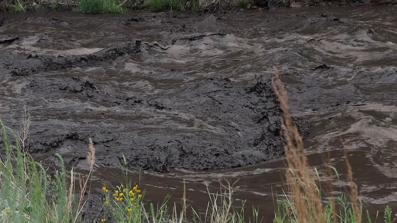 Environmental catastrophe as the Big Thomson river runs black with mud and ash following a landslide near Glen Haven Colorado July 15 2022