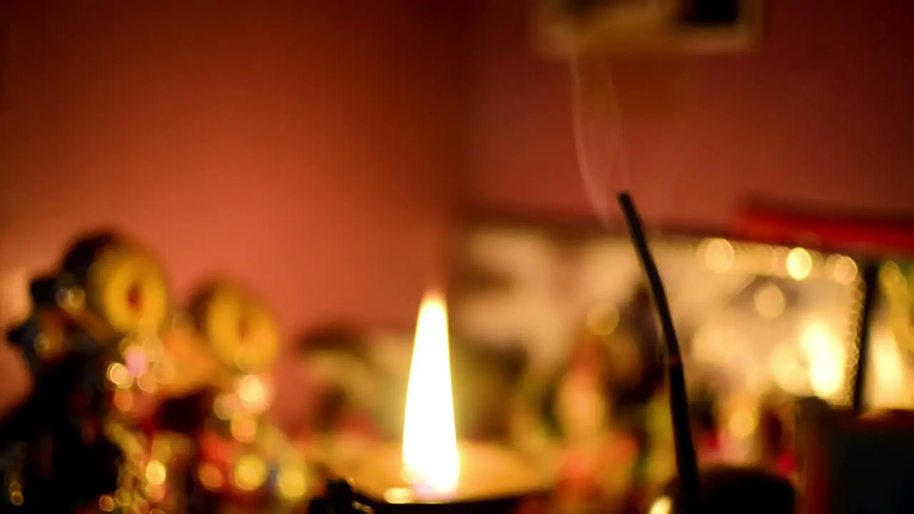 Blur shot of a joss stick agarbatti and lamp hindu prayer scene of temple religious