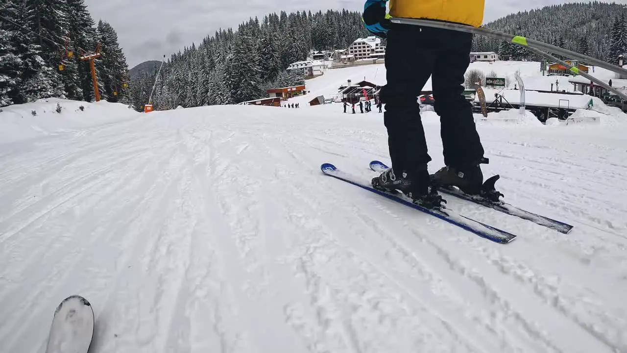 POV Shot Of Skier Skiing Down Snow Covered Slope 3