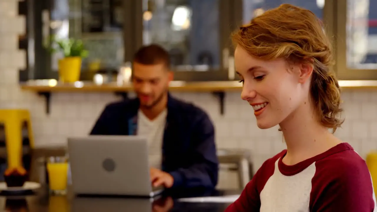 Smiling woman executive working in the office cafeteria 4k