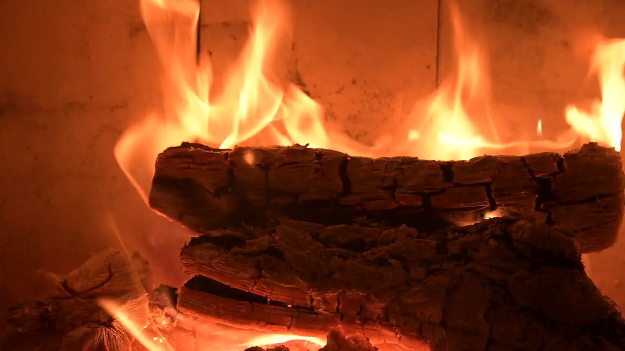 romantic fireplace at home with fire burning flame extreme close up