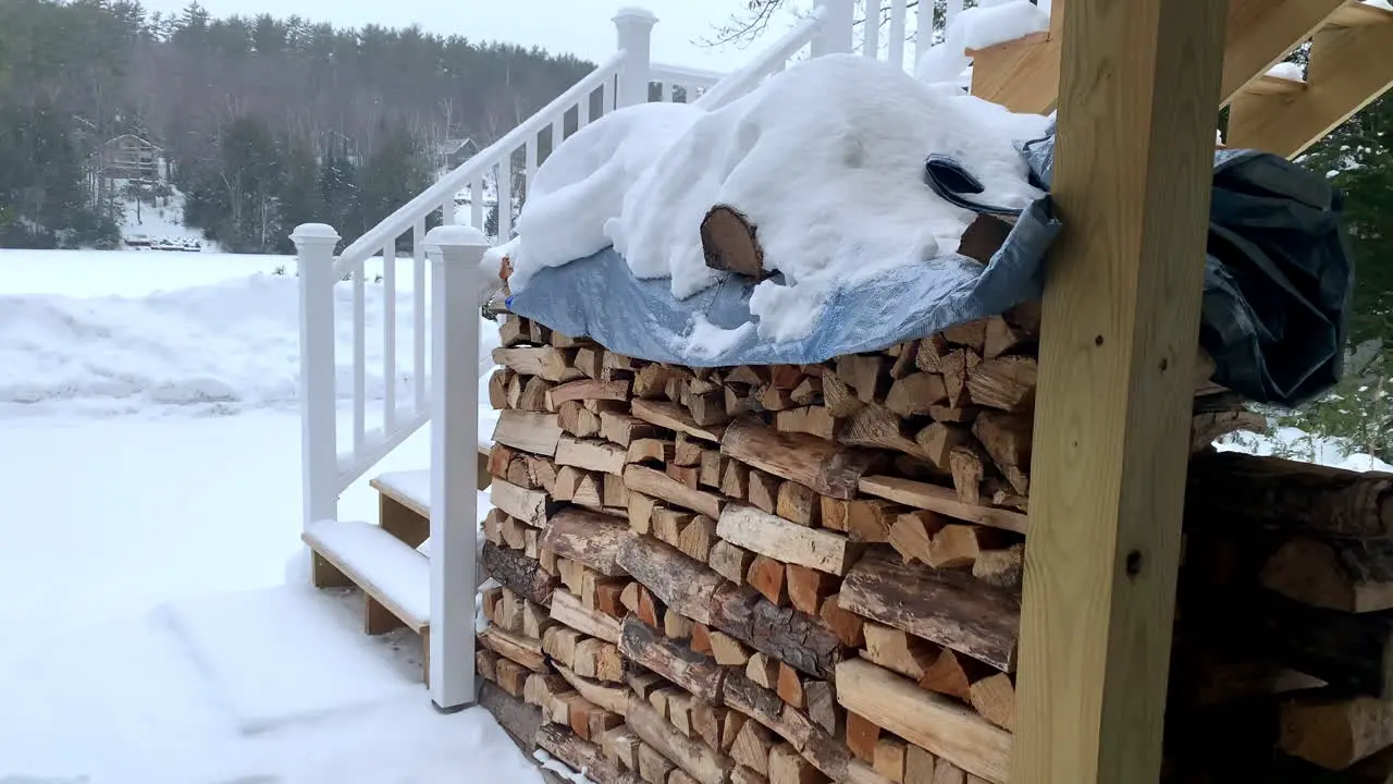 Medium Tilt of a Snow Covered Pile of Firewood