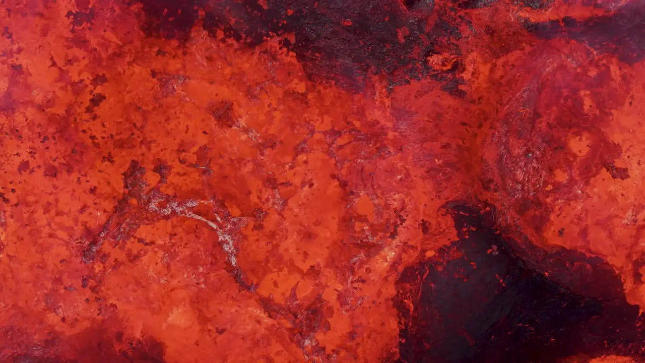 Close up of hot molten magma bubbling in volcano crater top down