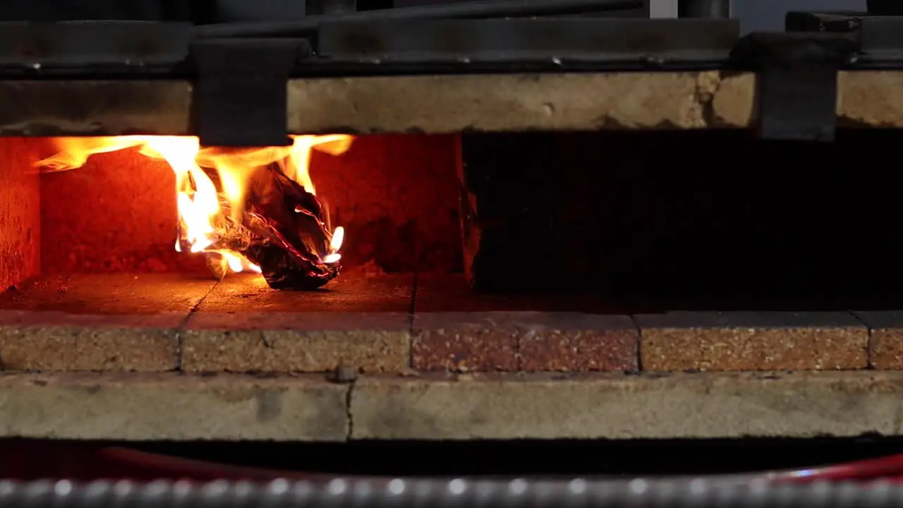 Burning fire in furnace in workshop