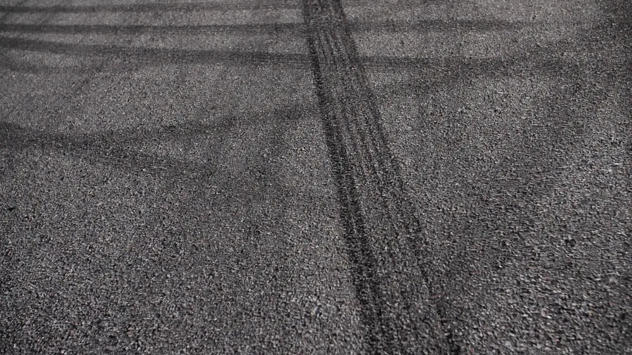 Drift marks on an asphalt from drift tires slow motion fly by