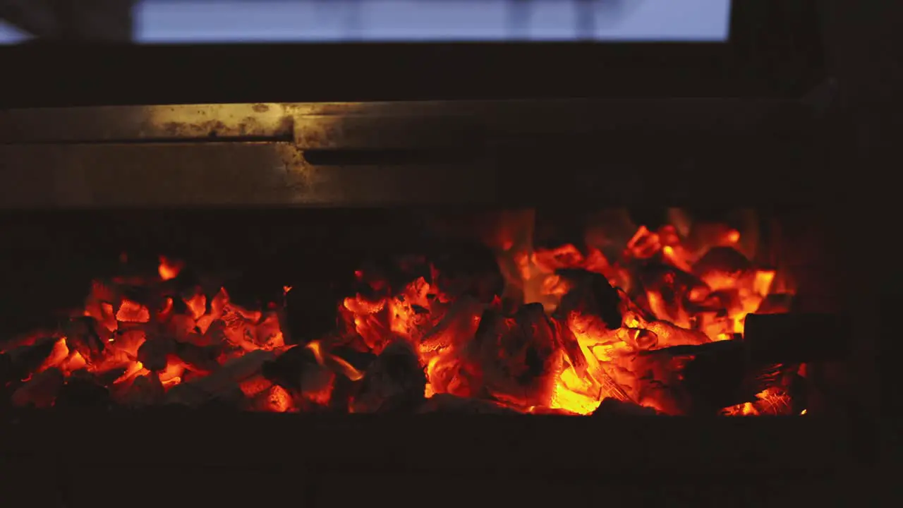 Close up coal and wood burning on bbq fire