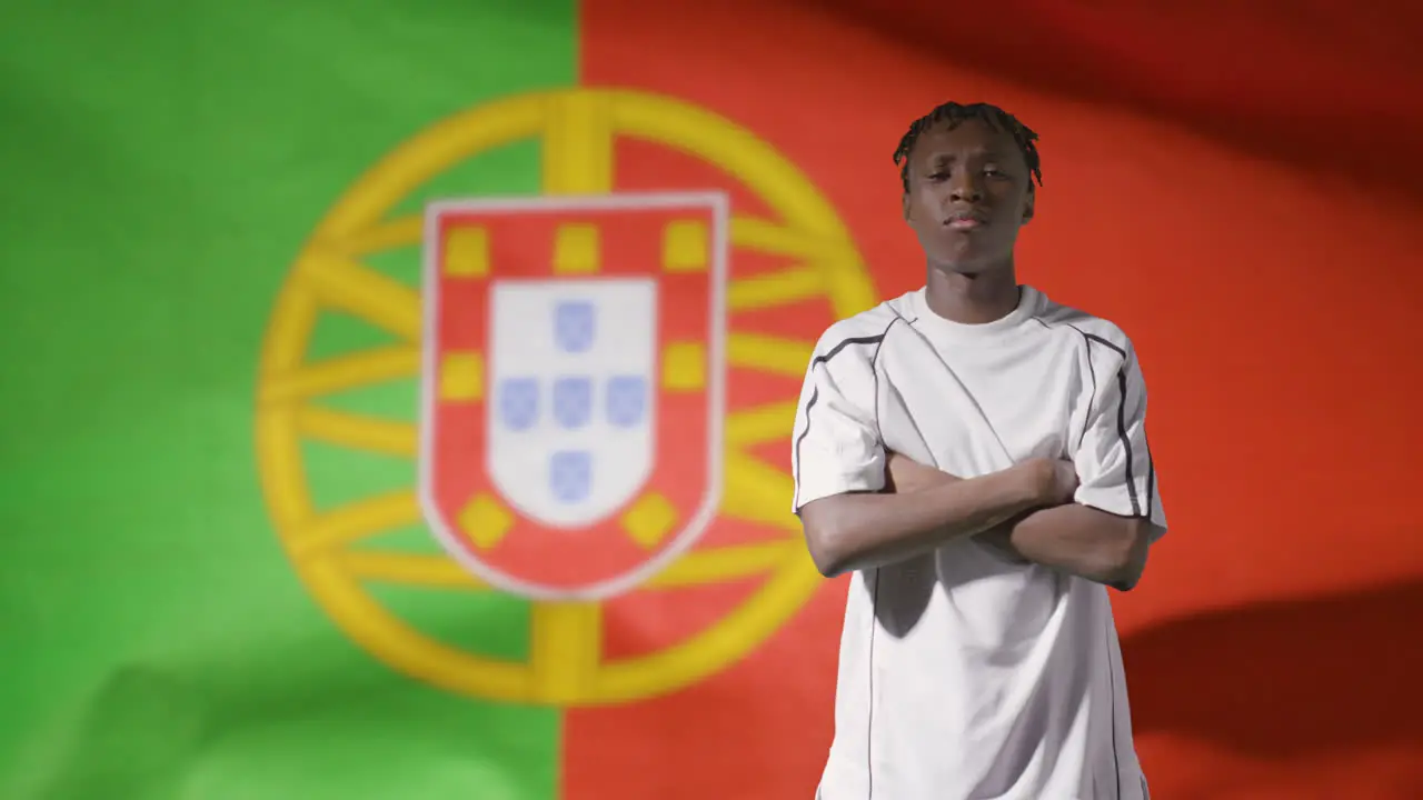 Young Footballer Posing In Front of Portugal Flag 02