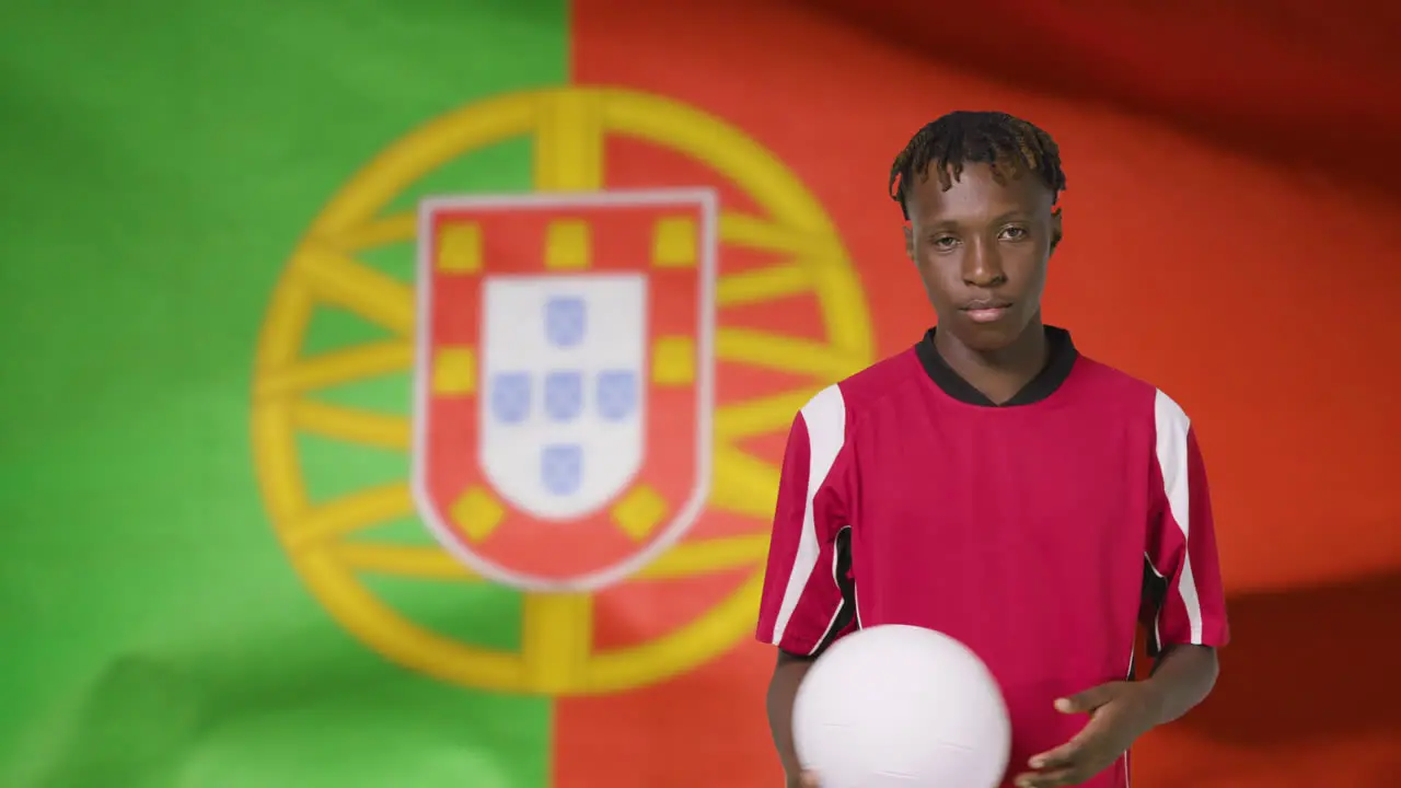 Young Footballer Posing In Front of Portugal Flag 01