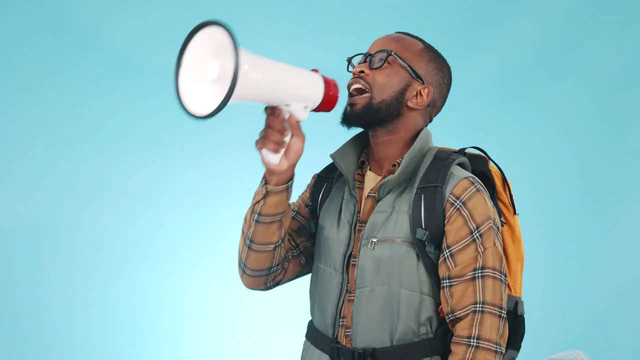 Megaphone talking and a black man on a blue