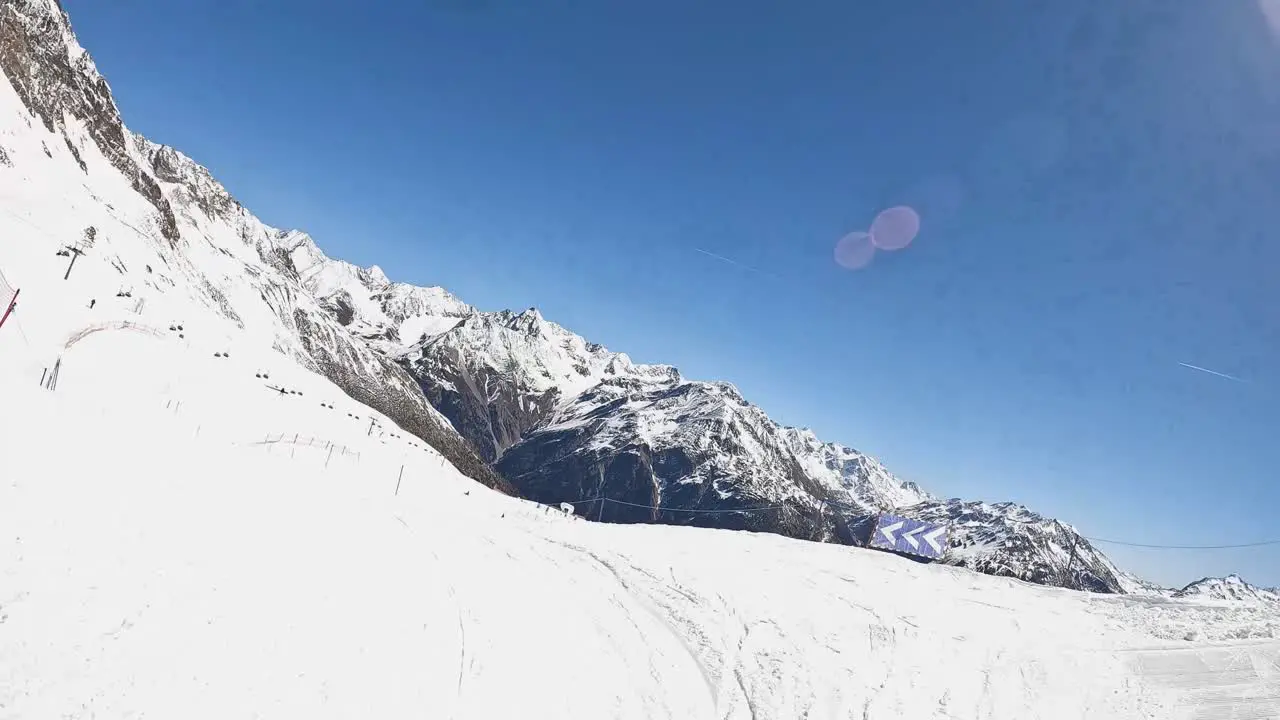 POV Shot Of Skier Skiing Down Snow Covered Mountain Slope Solden Austria Tunnel