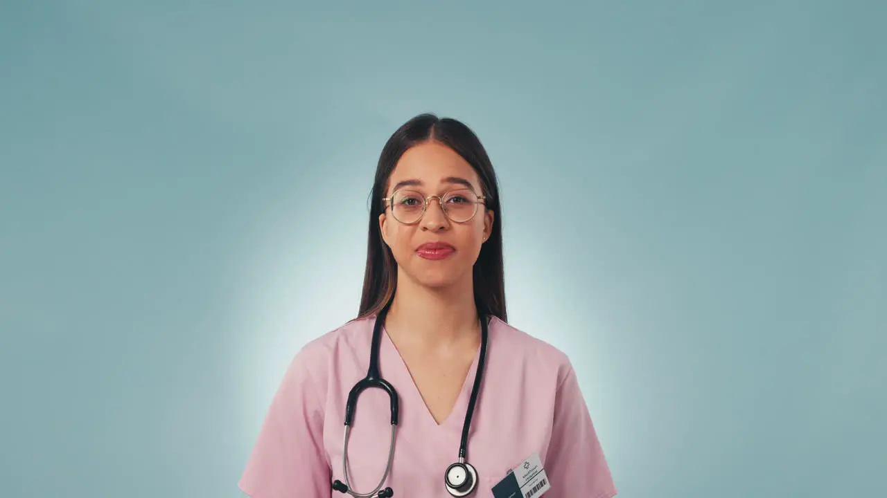 Portrait studio and woman doctor pointing