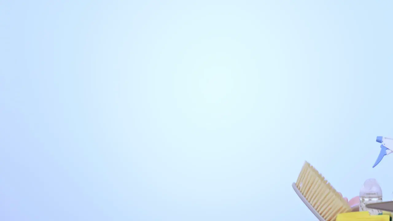 Person hands and bucket of cleaning supplies